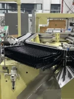 welldone-sanitary-pad-packing-machine-auto-stacking-finger-system-closeup