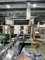 welldone-sanitary-pad-packing-machine-finished-packs-output-conveyor-closeup