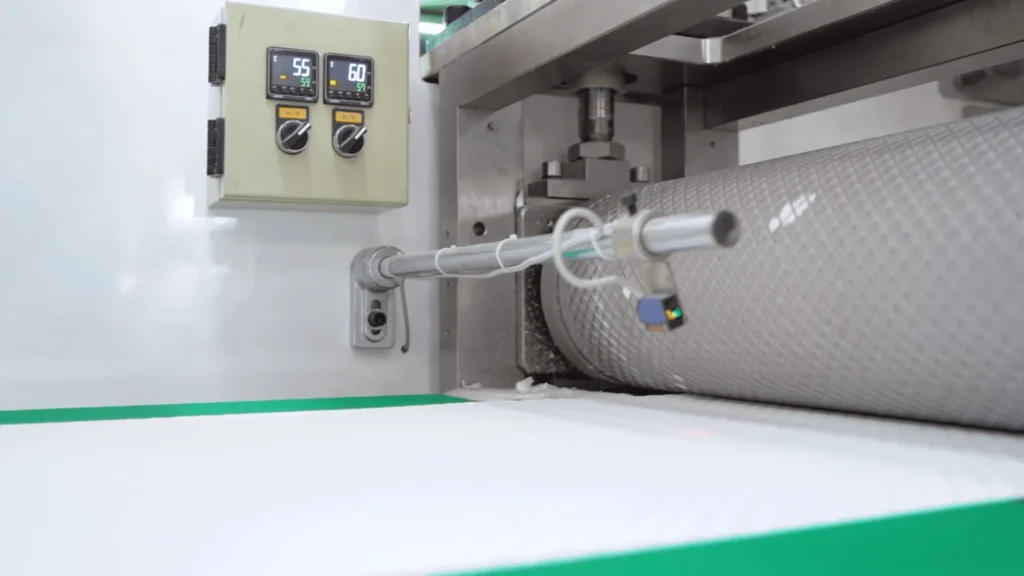 Embossing pressure and temperature control unit on a Welldone pet pad line