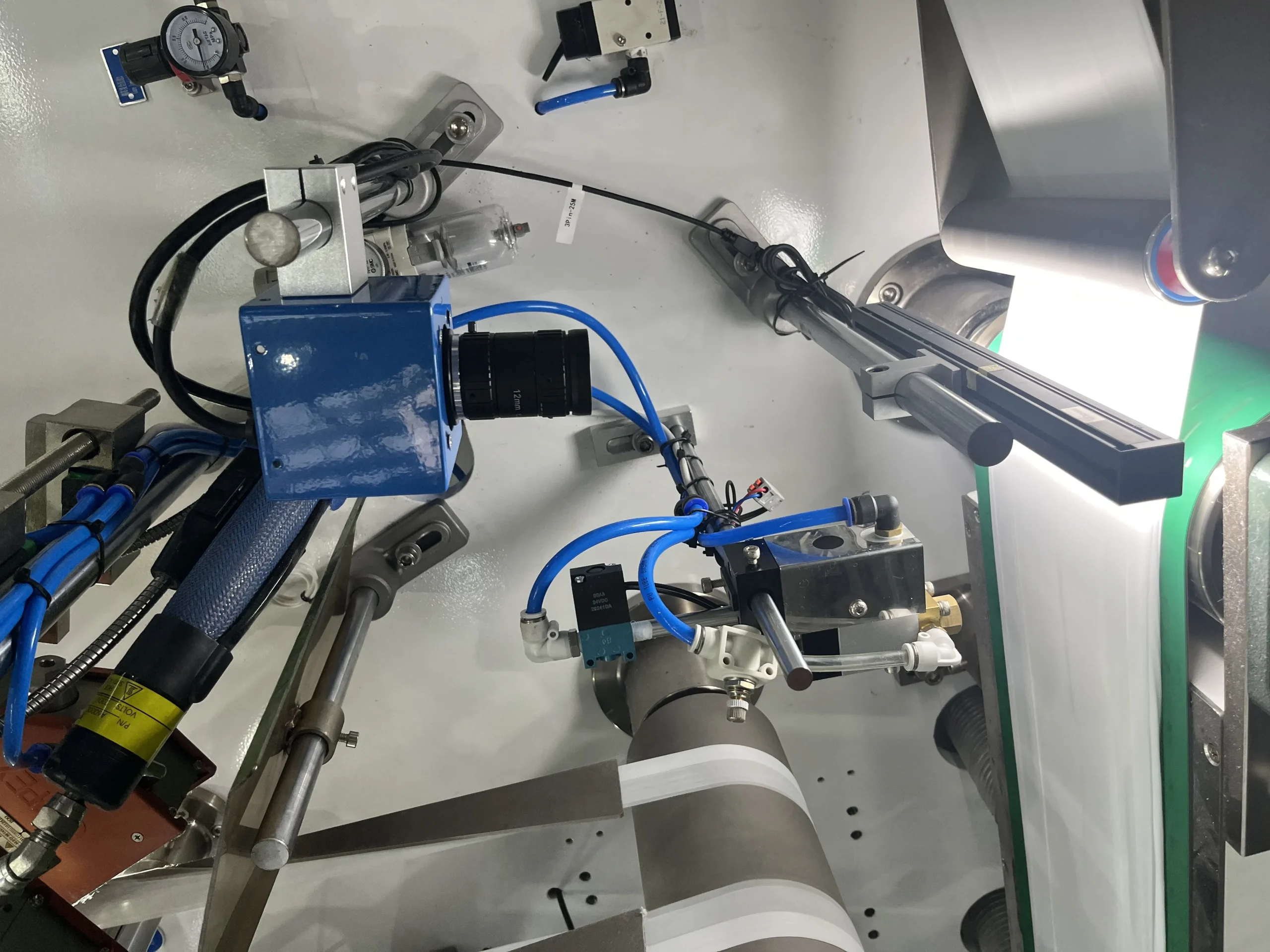 Machine vision camera array over adult pull-up conveyor with LED ring illumination
