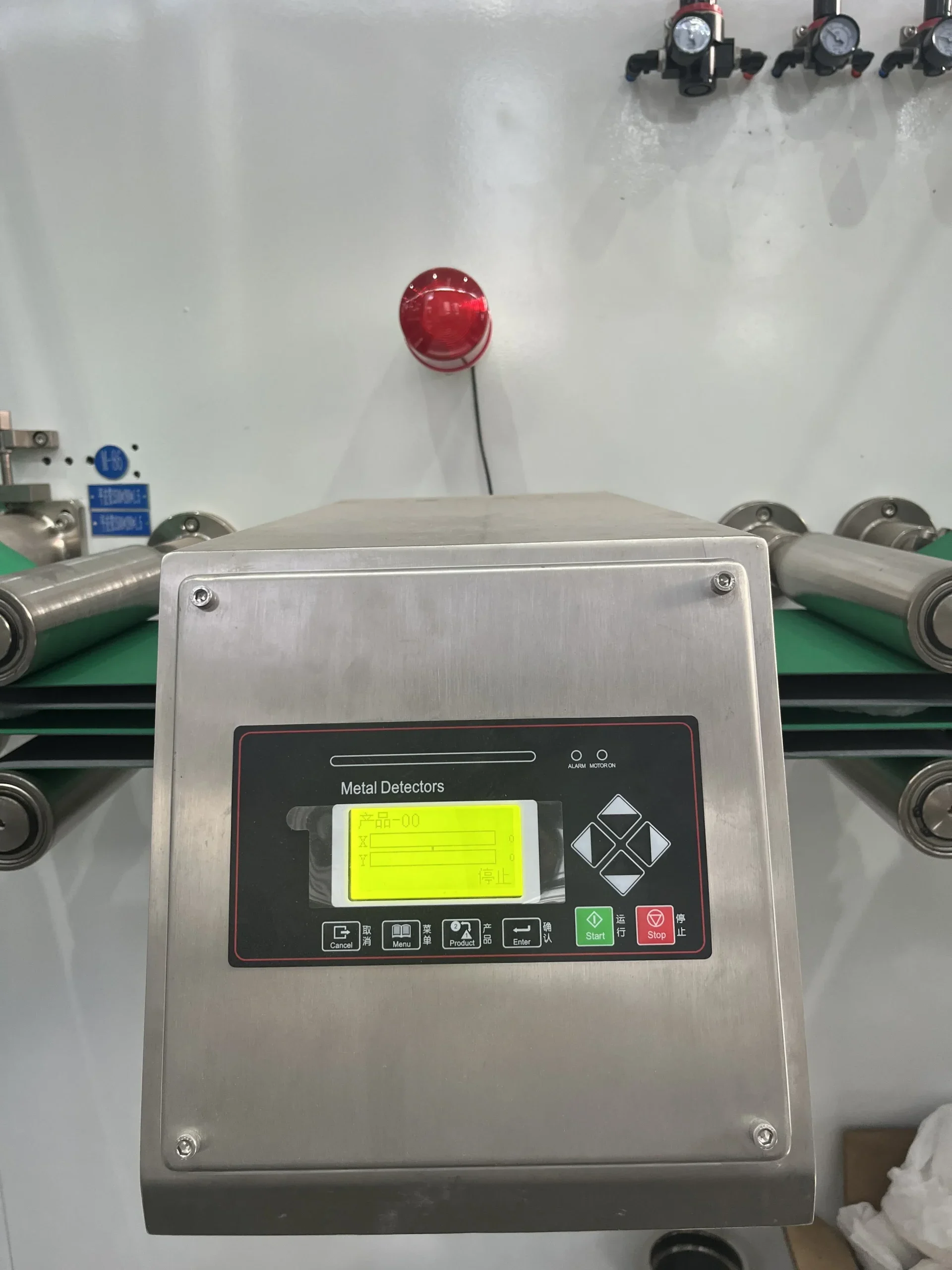 Metal detection head with alarm beacon on Welldone adult pull-up packaging line