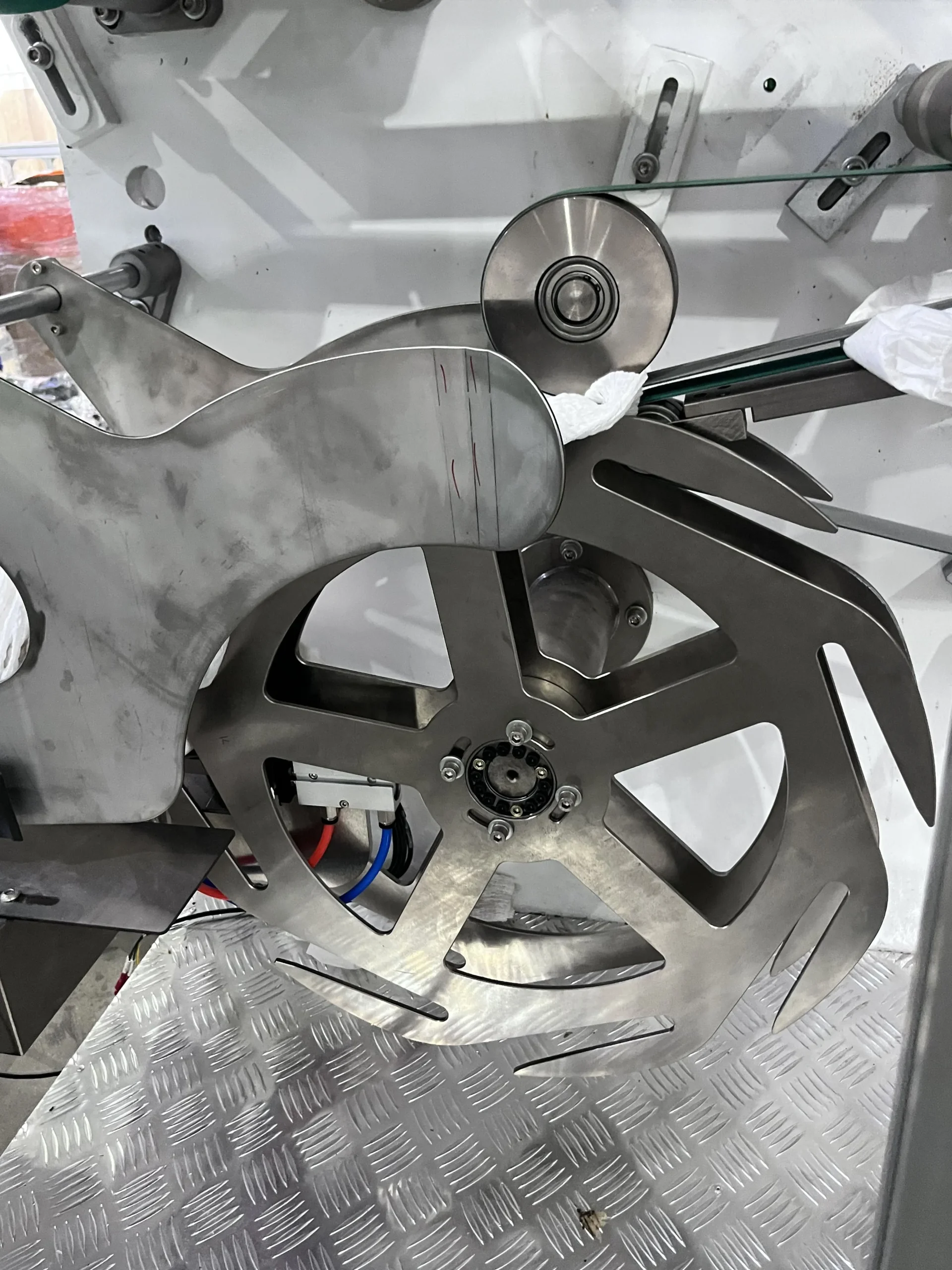 Welldone baby diaper vacuum suction plate detail — dense perforated surface for product holding precision