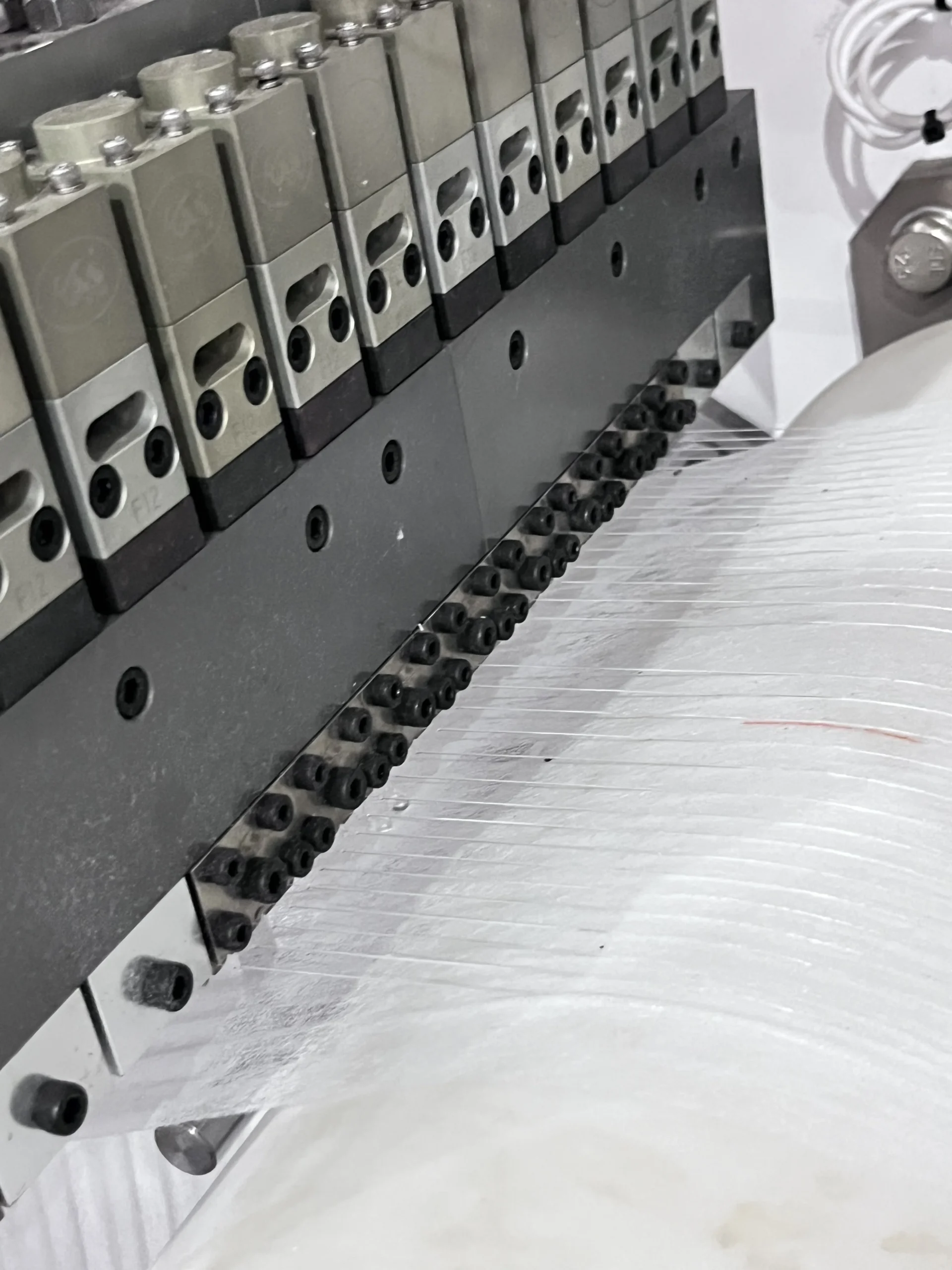 Waistband lamination control section on a baby pull-up diaper line